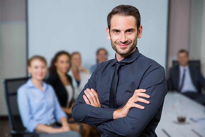 man-smiling-with-colleagues